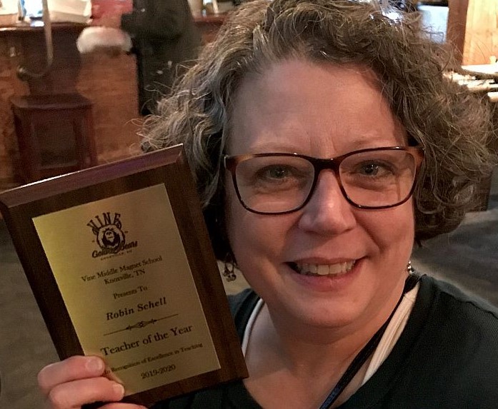 Photo of Robin Schell with award