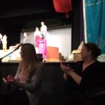 Student with mentor interpreting at theatre event